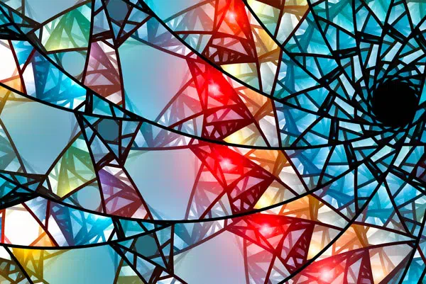 Abstract stained glass background with vibrant, colorful shapes forming a mesmerizing mosaic.