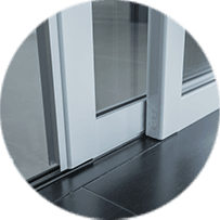 A sliding glass door with a white frame.