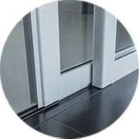 A sliding glass door with a white frame.