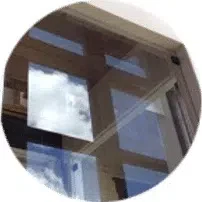 A windowpane made of glass, revealing a scenic sky view.