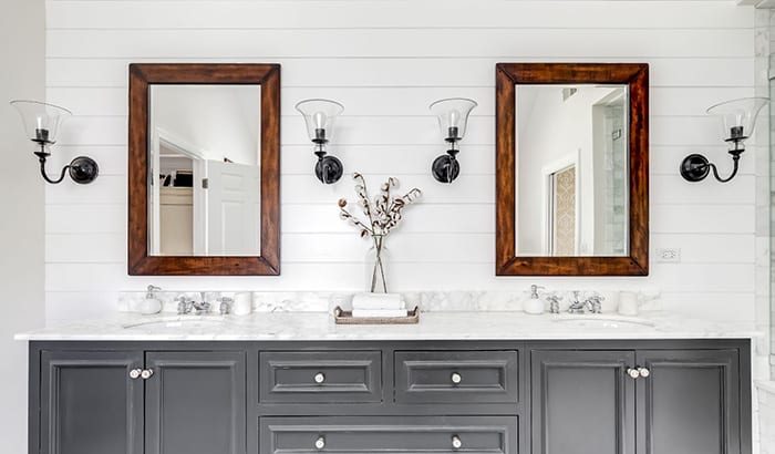 two-custom-made-mirrors-and-a-sink-in-a-bathroom