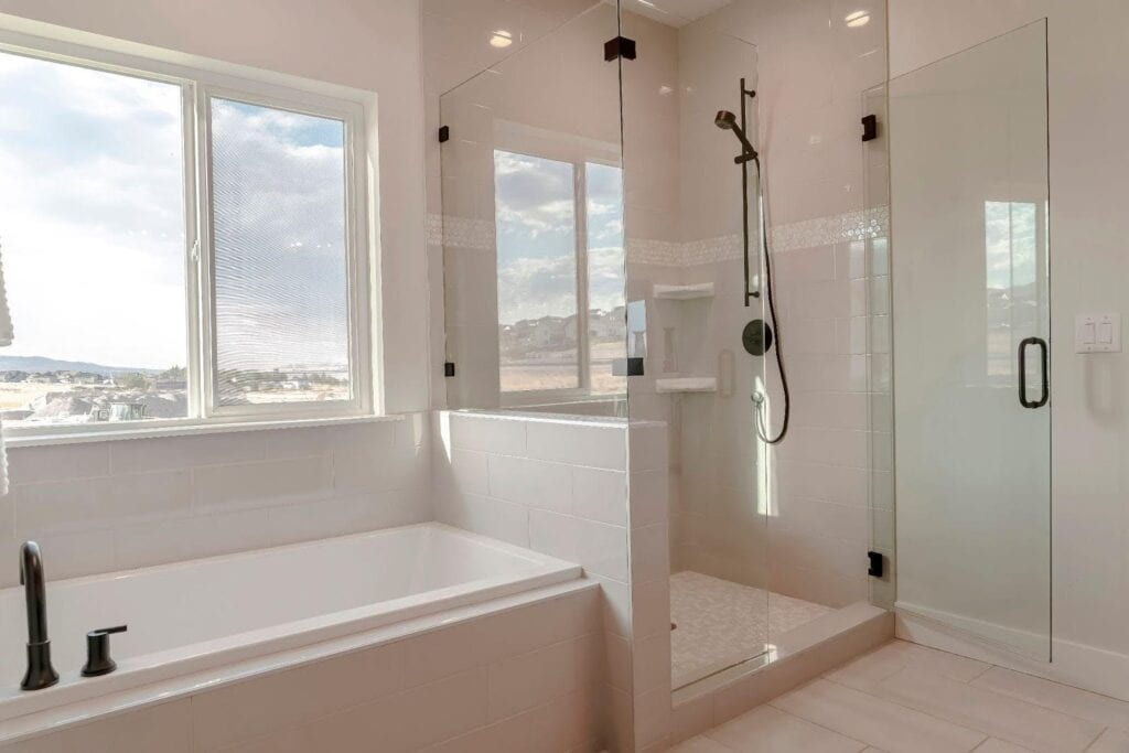 A modern bathroom with a glass shower door and stylish bathtub for a serene atmosphere