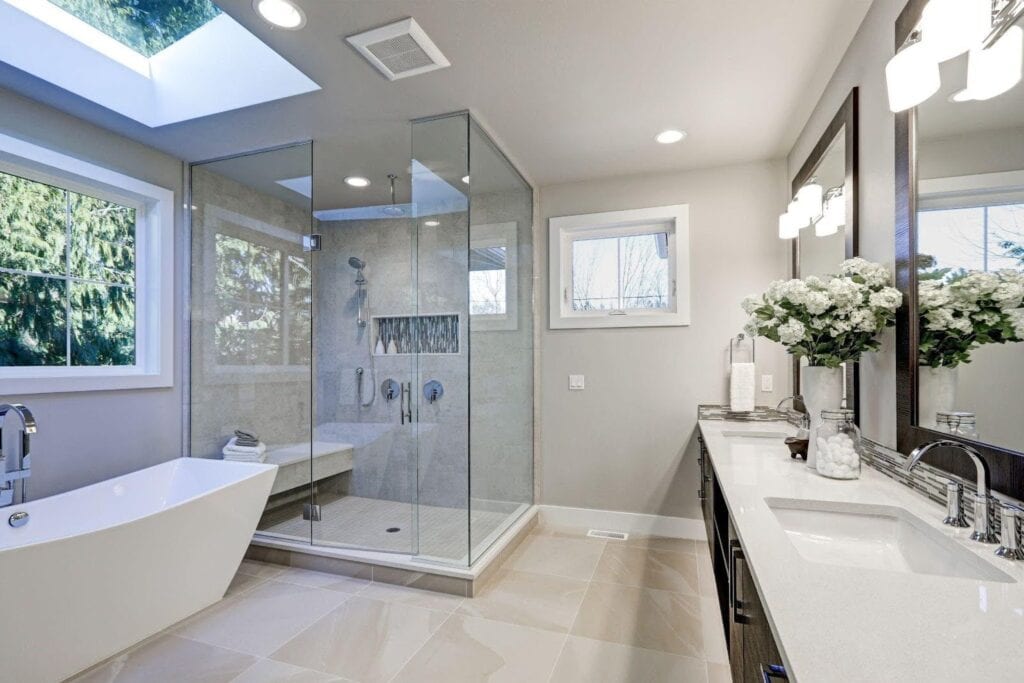A clean bathroom with a spacious shower and modern sink