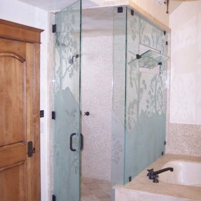 A spacious bathroom with twin sinks and a mirror for each person.