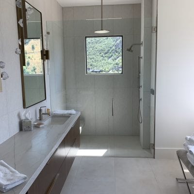 A well-equipped bathroom with a shower, sink, and tub.