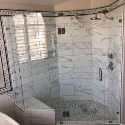 A modern bathroom with a sleek shower and a luxurious tub.