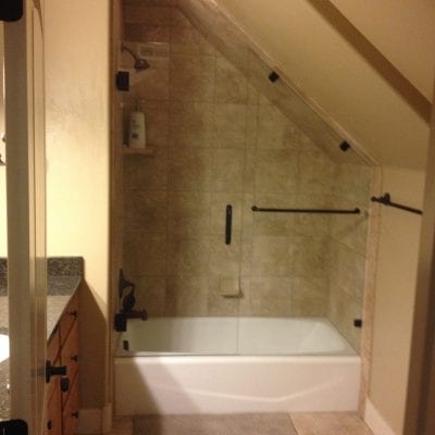 A bathroom with a shower and tub, providing a relaxing and refreshing space for personal hygiene.