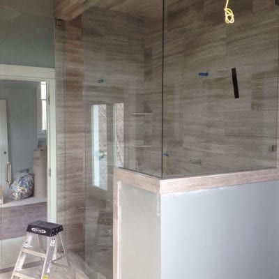 Modern bathroom featuring glass shower door.