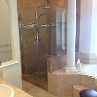 A bathroom with a shower, tub, and sink.